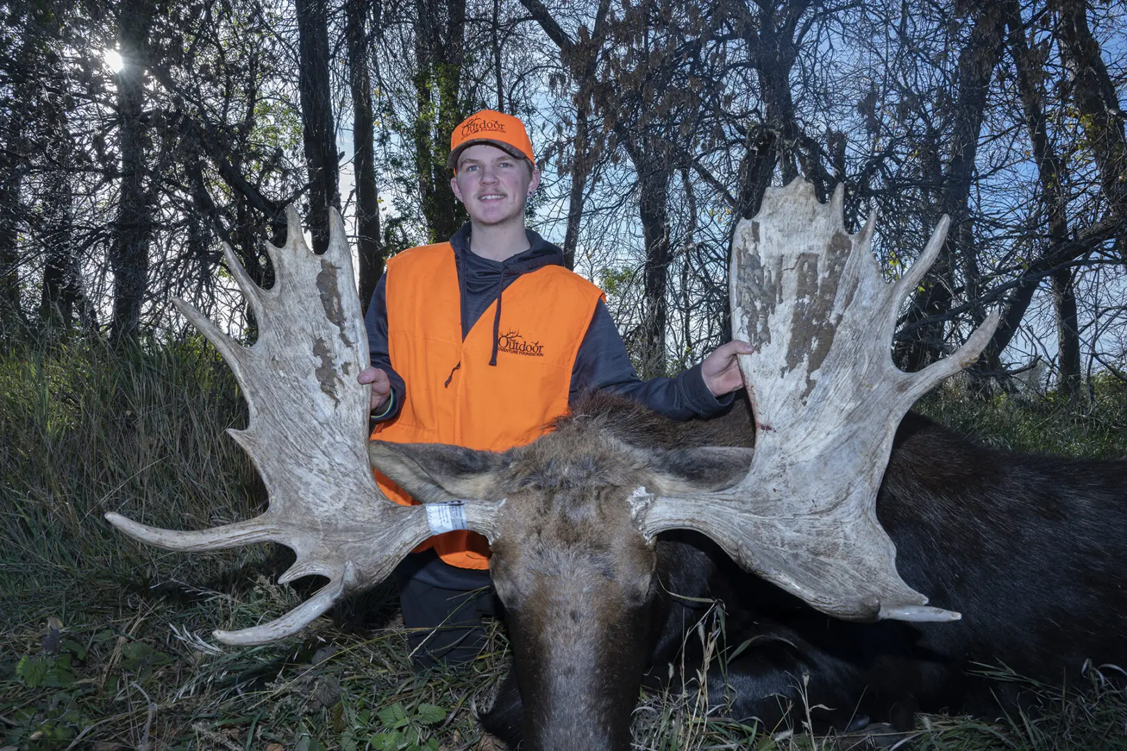 Outdoor Adventure Foundation hunt recipient Case Thompson poses with his North Dakota bull moose harvested Oct. 15, 2023.