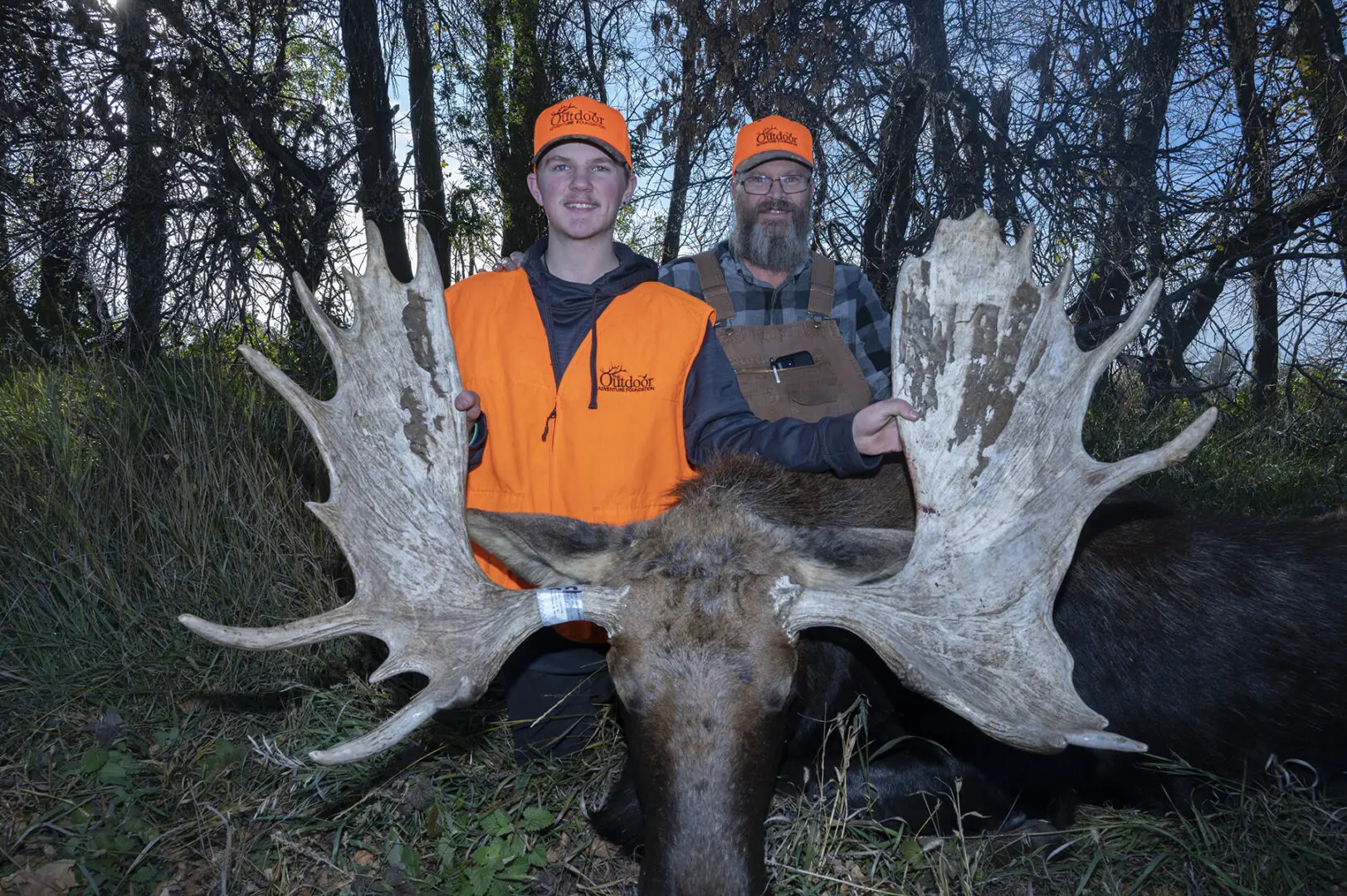 Outdoor Adventure Foundation hunt recipient Case Thompson poses with his North Dakota bull moose harvested Oct. 15, 2023, along with his father David Thompson.