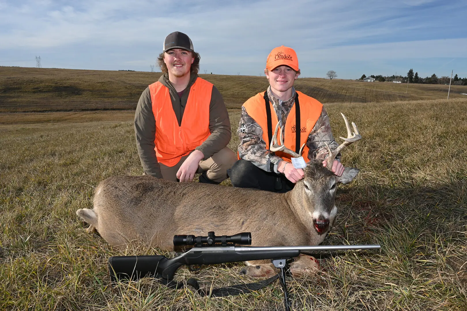 Tyle Brusseau, left, with Dash Ohlsen and his white-tailed deer buck.
