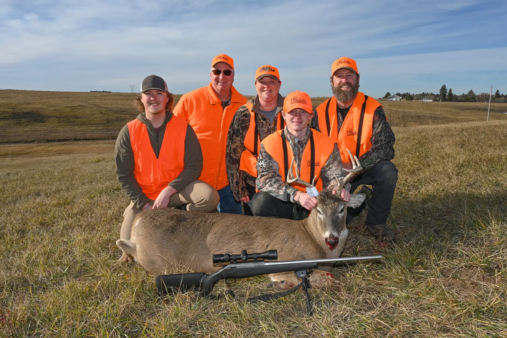 From left to right Tyler Brusseau, Chad Brusseau, Kara Ohlsen, Dash Ohlsen and Taner Ohlsen pose with Dash's white-tailed buck.